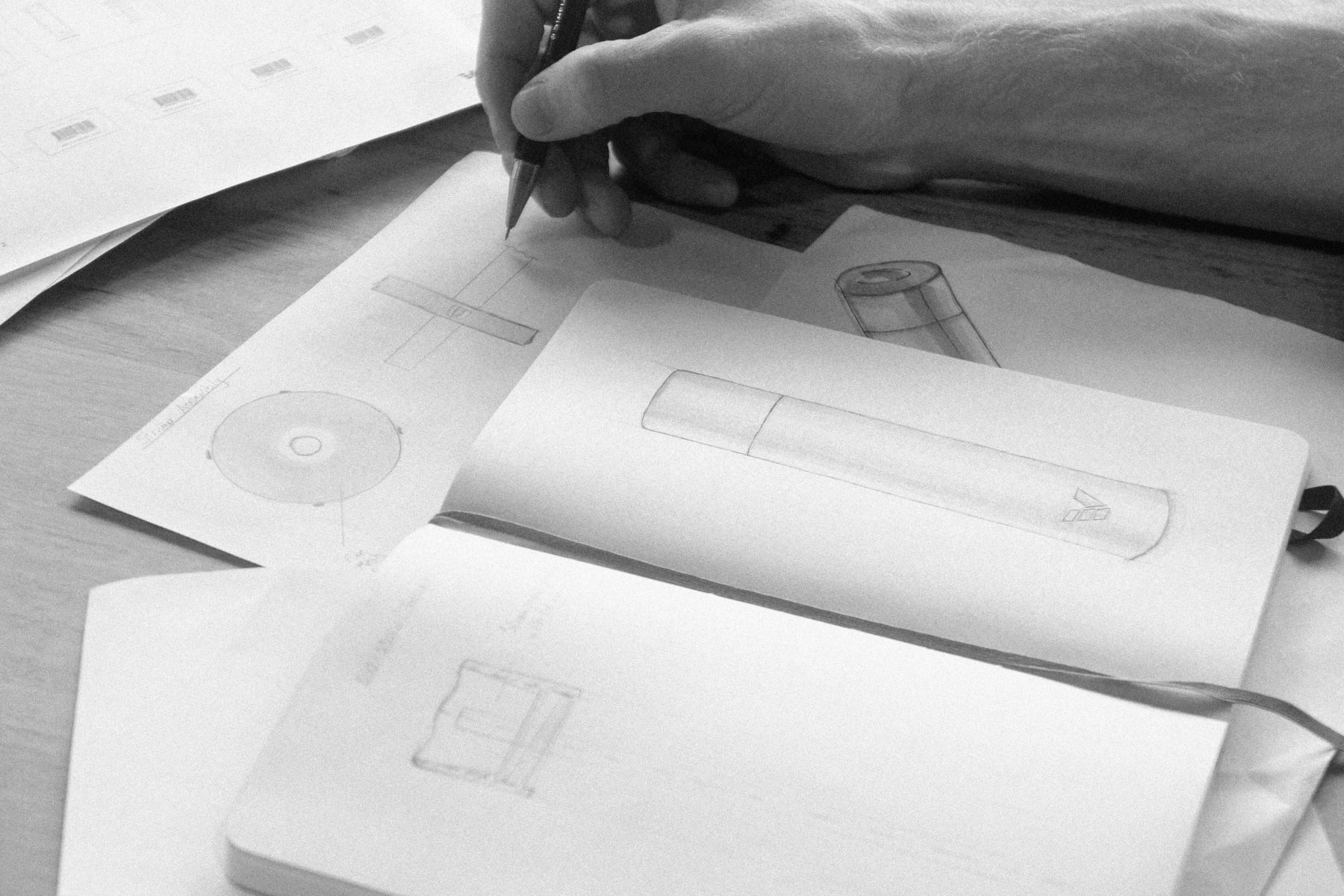 Ever Vessel founder Tim hand drawing the early drinking bottle and straw assembly concept