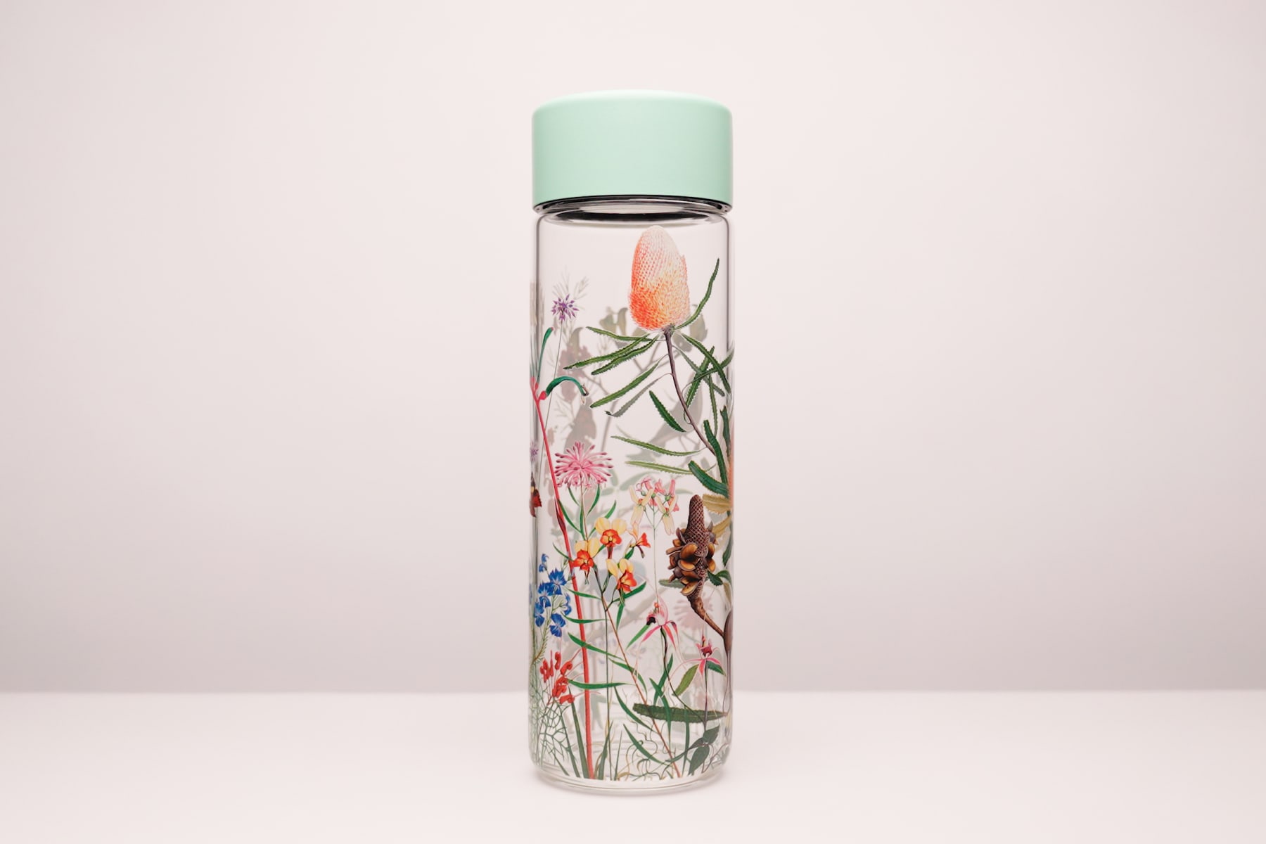 Custom water bottle of a flower design uv printed onto a glass Ever Vessel