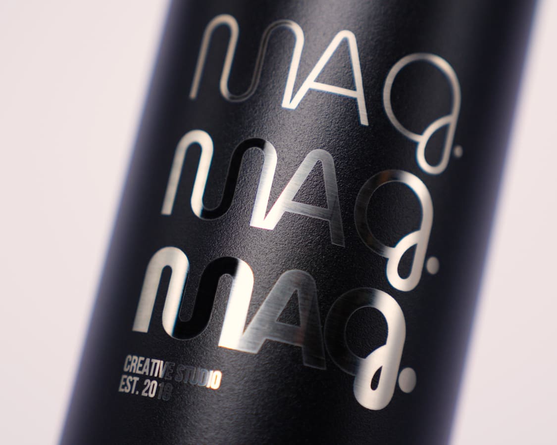 Custom water bottle of a company logo laser engraved on a black Ever Vessel