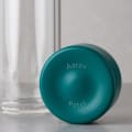 Personalized Ever Vessel Glass Multi double walled glass tea infuser bottle with the teal green lid removed showing the laser engraved name.