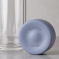 Personalized Ever Vessel Glass Multi double walled glass tea infuser bottle with the lilac lid removed showing the laser engraved name.