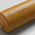 Personalized Ever Vessel stainless steel water bottle in yellow with laser engraved text Rise & Shine Sunshine on the side.