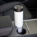 An Ever Vessel Maxi White stainless steel water bottle sitting in car cup holder.