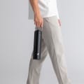 Male with an Ever Vessel Super Maxi Black Sand stainless steel water bottle, holding with the integrated handle