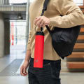 Ever Vessel Red Super Maxi insulated water bottle being held by handle