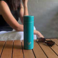 Female with ever vessel multi tea flask in teal green