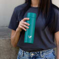 Female with ever vessel multi tea flask in teal green