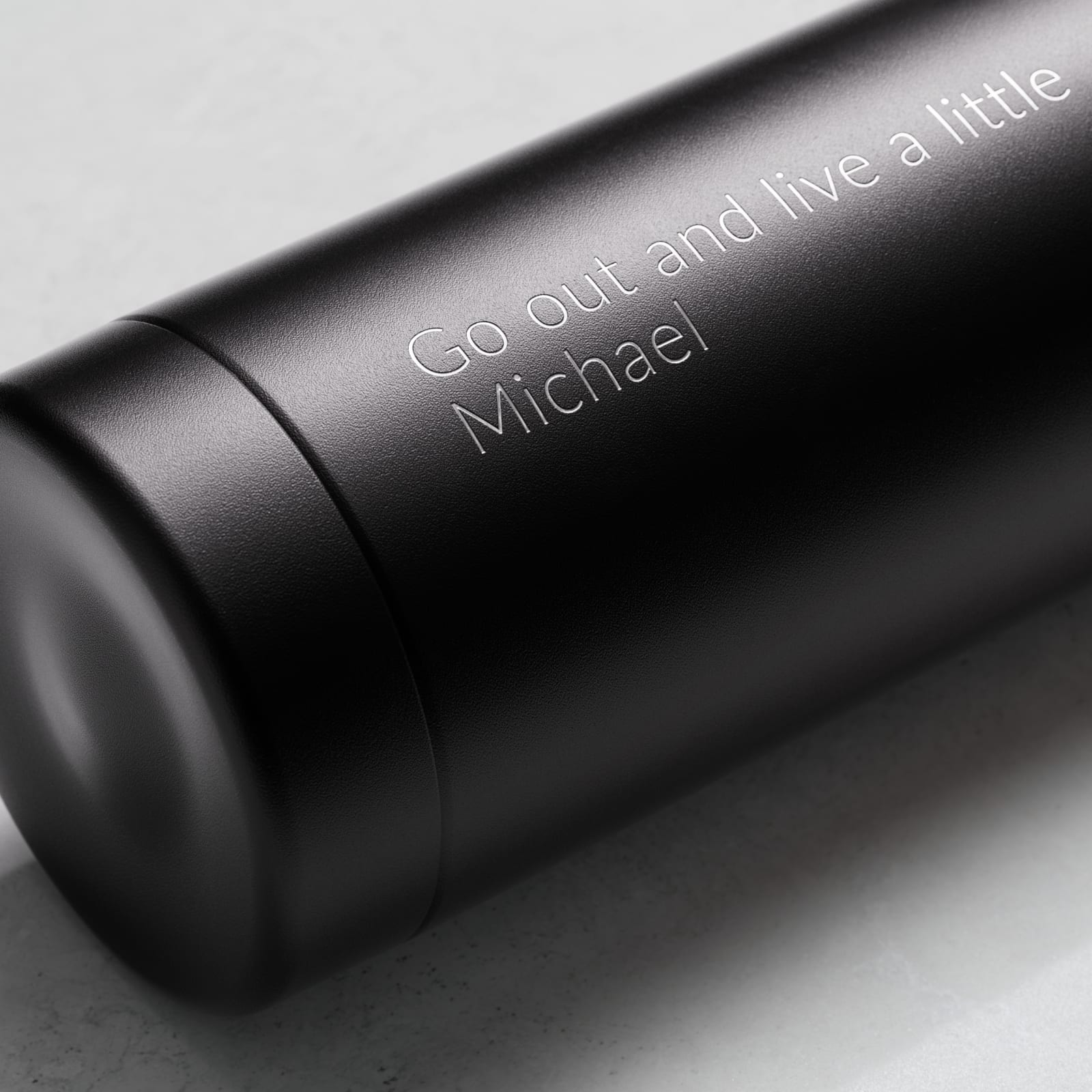 Personalized Ever Vessel Multi Black tea infuser water bottle with laser engraved text on the side.
