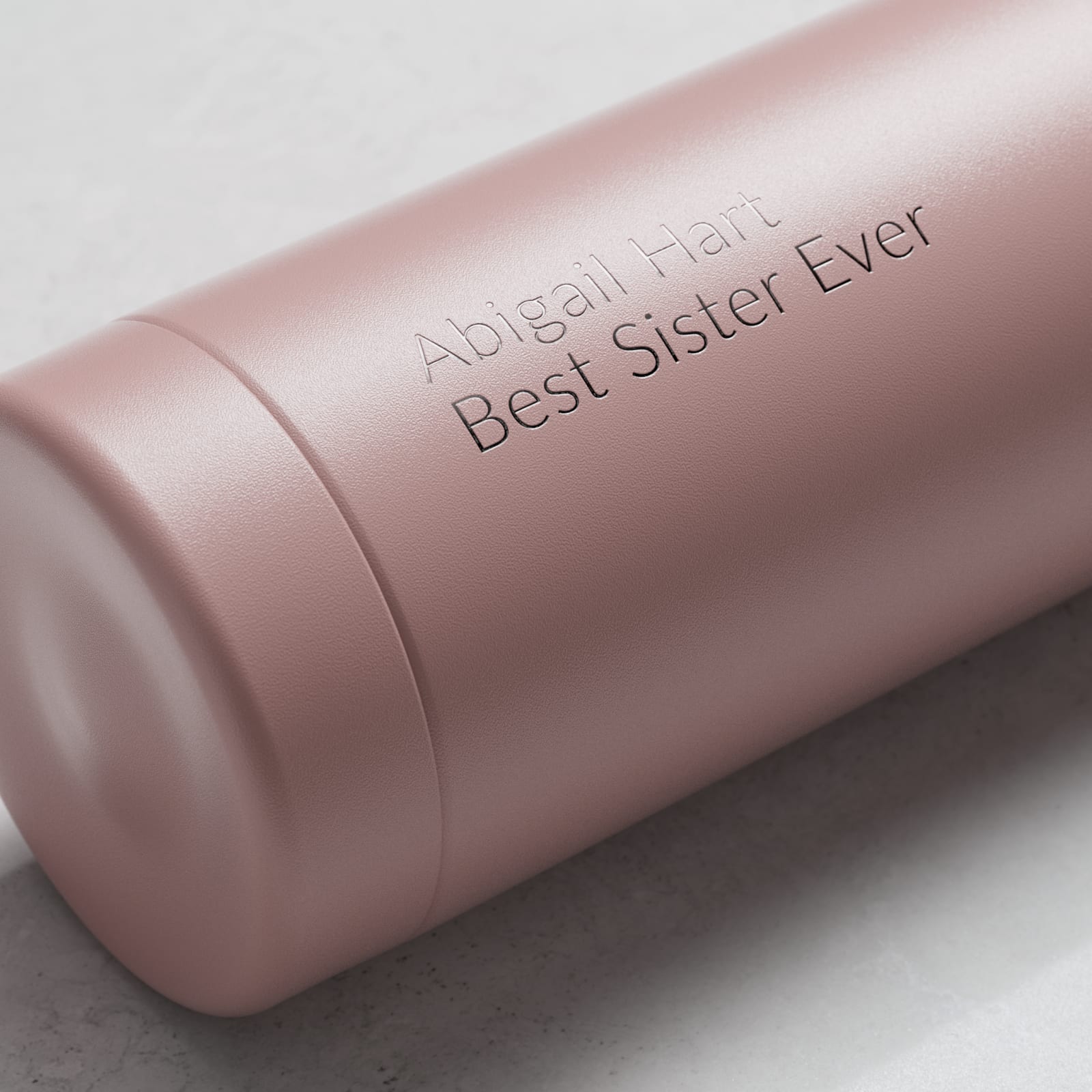 Personalized Ever Vessel Multi Rose Pink tea infuser water bottle with laser engraved name Abigail Hart on the side.