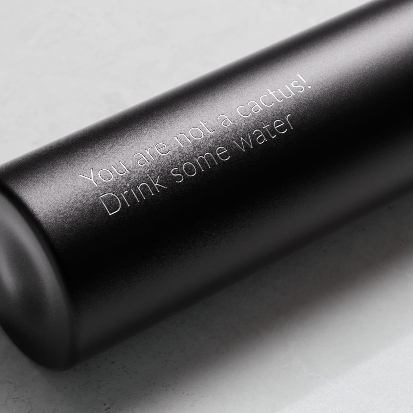 Personalized Ever Vessel Mini Black small water bottle with laser engraved text on the side.