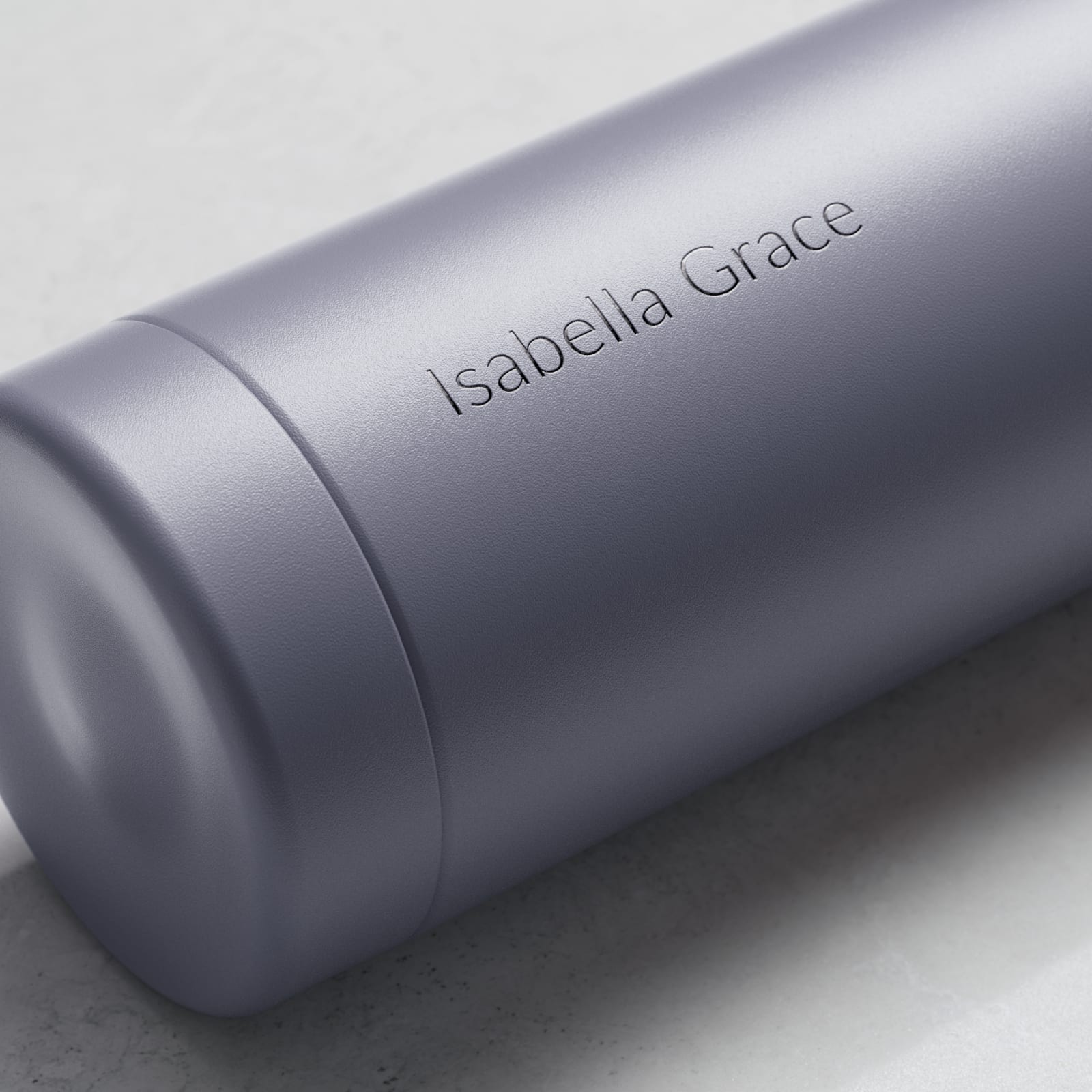 Personalized Ever Vessel stainless steel water bottle in lilac with laser engraved name Isabella Grace on the side.