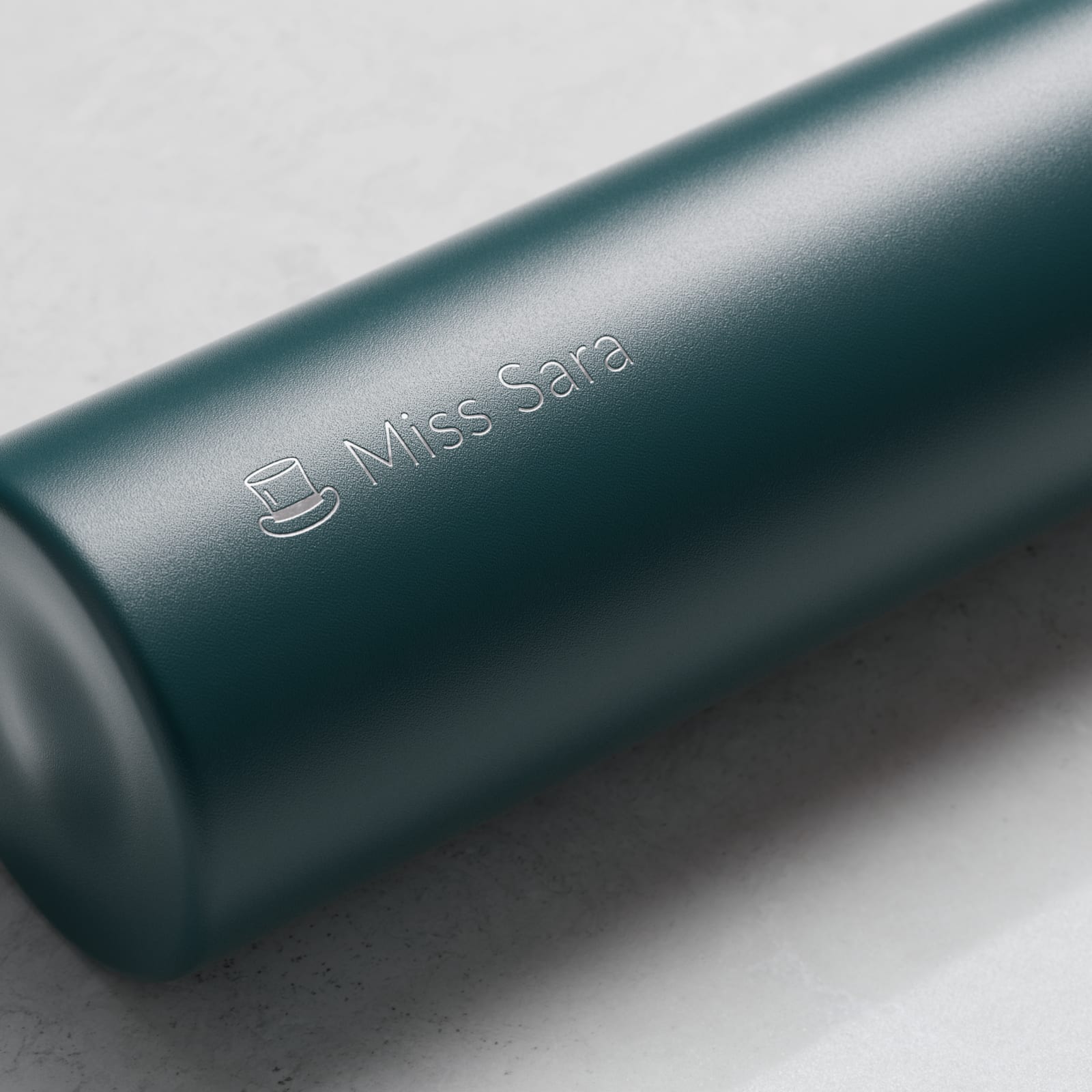 Personalized Ever Vessel Mini Teal green small water bottle with laser engraved name Miss Sara and emoji on the side.