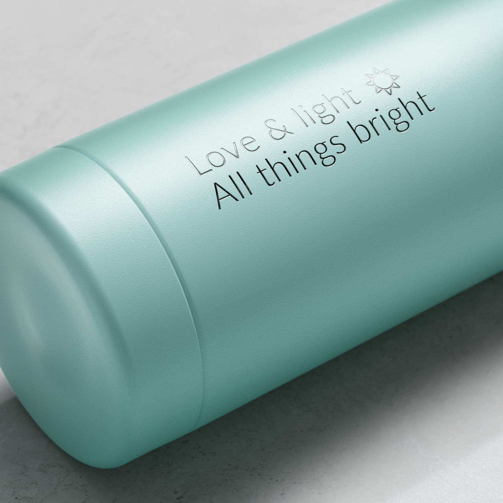 Personalized Ever Vessel stainless steel water bottle in mint green with laser engraved message Love & light  All things bright with emoji on the side.