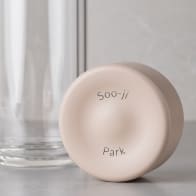 Personalized Ever Vessel Glass Multi double walled glass tea infuser bottle with the desert beige lid removed showing the laser engraved name.