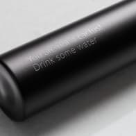 Personalized Ever Vessel Mini Black small water bottle with laser engraved text on the side.