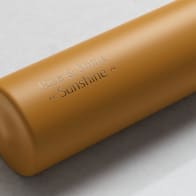 Personalized Ever Vessel Mini Yellow small water bottle in with laser engraved text Rise & Shine Sunshine on the side.