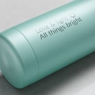 Personalized Ever Vessel stainless steel water bottle in mint green with laser engraved message Love & light  All things bright with emoji on the side.