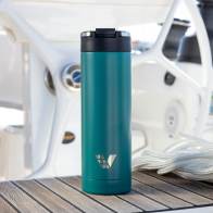 An Ever Vessel Maxi Teal Green stainless steel water bottle on the deck of a yacht.
