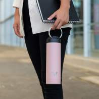 A female carrying her Ever Vessel Maxi Rose Pink stainless steel water bottle with integrated carry handle at work.