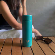 Female with ever vessel multi tea flask in teal green