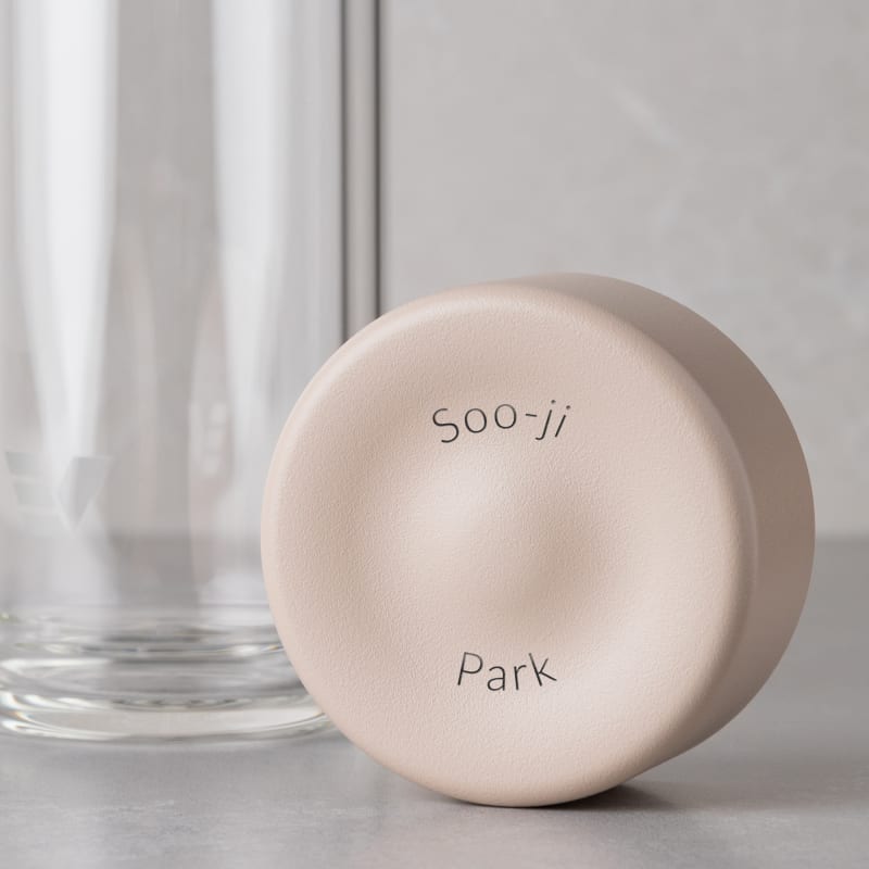 Personalized Ever Vessel Glass Multi double walled glass tea infuser bottle with the desert beige lid removed showing the laser engraved name.