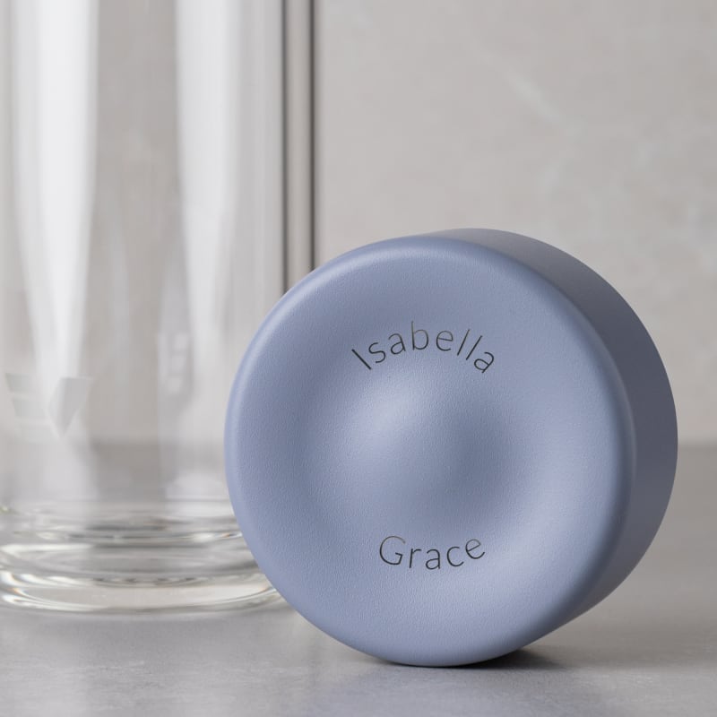 Personalized Ever Vessel Glass Multi double walled glass tea infuser bottle with the lilac lid removed showing the laser engraved name.