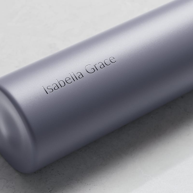 A Personalized Ever Vessel Mini Lilac small water bottle with laser engraved name Isabella Grace on the side.