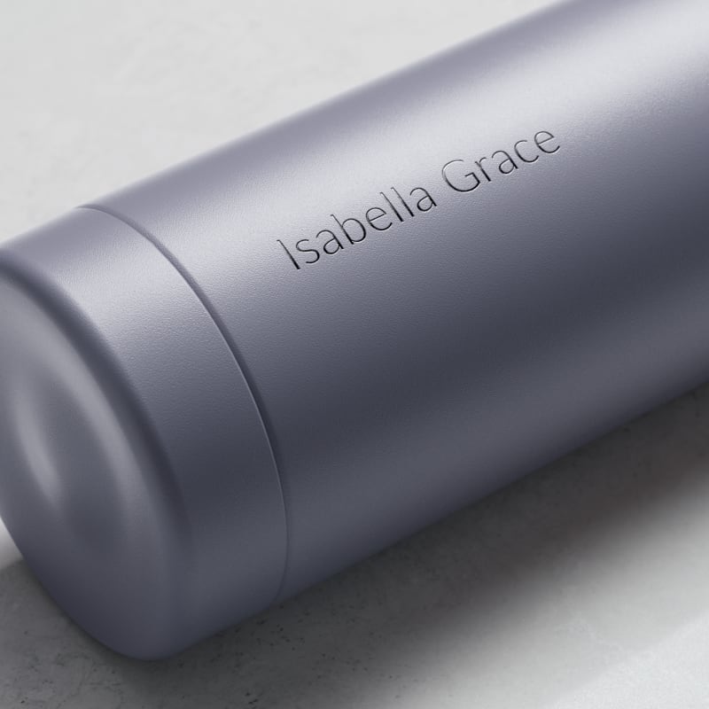 Personalized Ever Vessel stainless steel water bottle in lilac with laser engraved name Isabella Grace on the side.