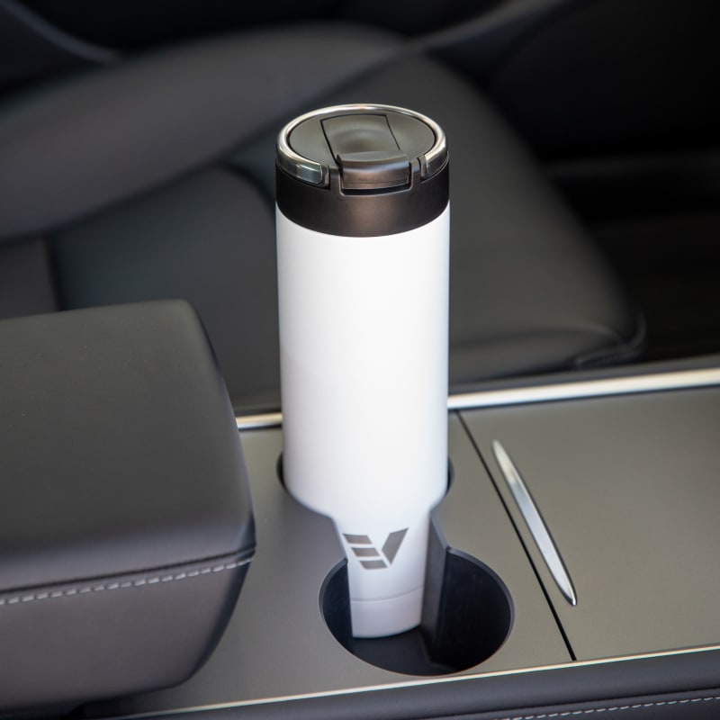 An Ever Vessel Maxi White stainless steel water bottle sitting in car cup holder.