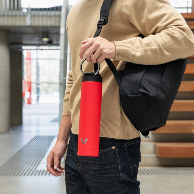 Ever Vessel Red Super Maxi insulated water bottle being held by handle
