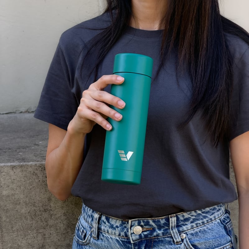 Female with ever vessel multi tea flask in teal green