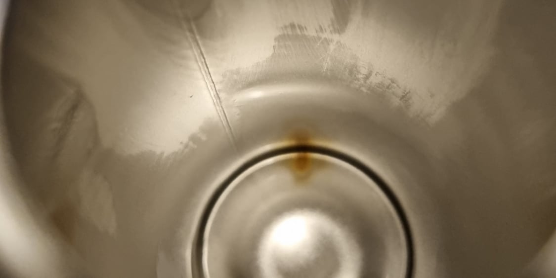 Inside of bottle with a rust mark