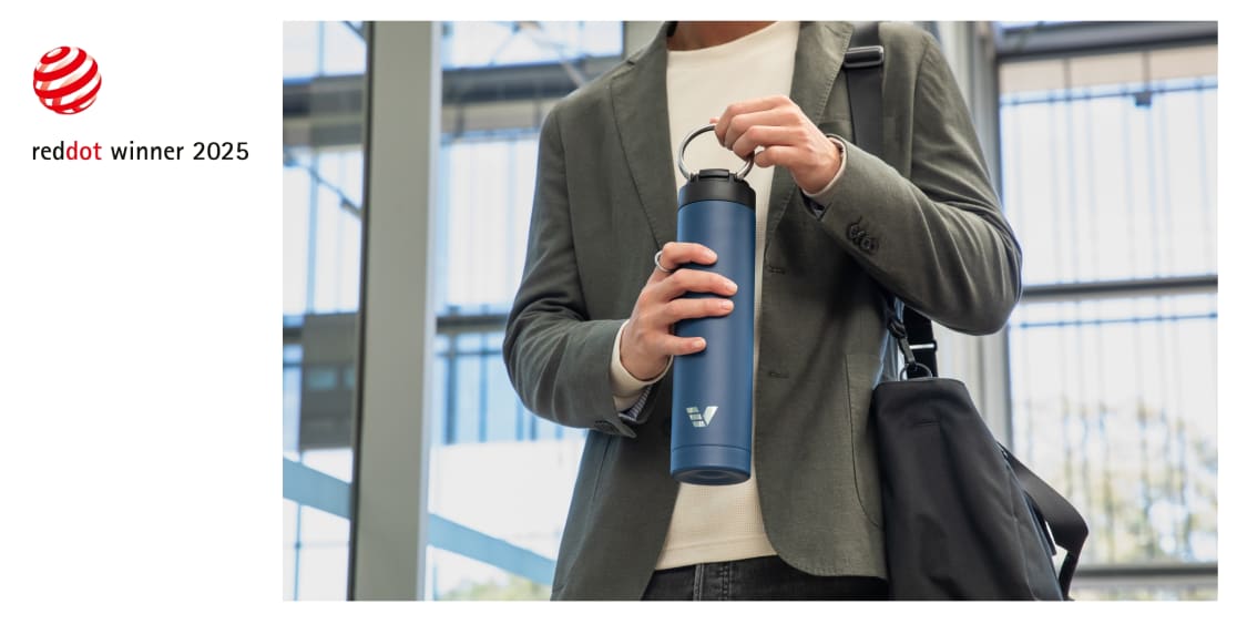 Ever Vessel Red Dot Design award blog image showing Super Maxi water bottle in blue being carried by handle