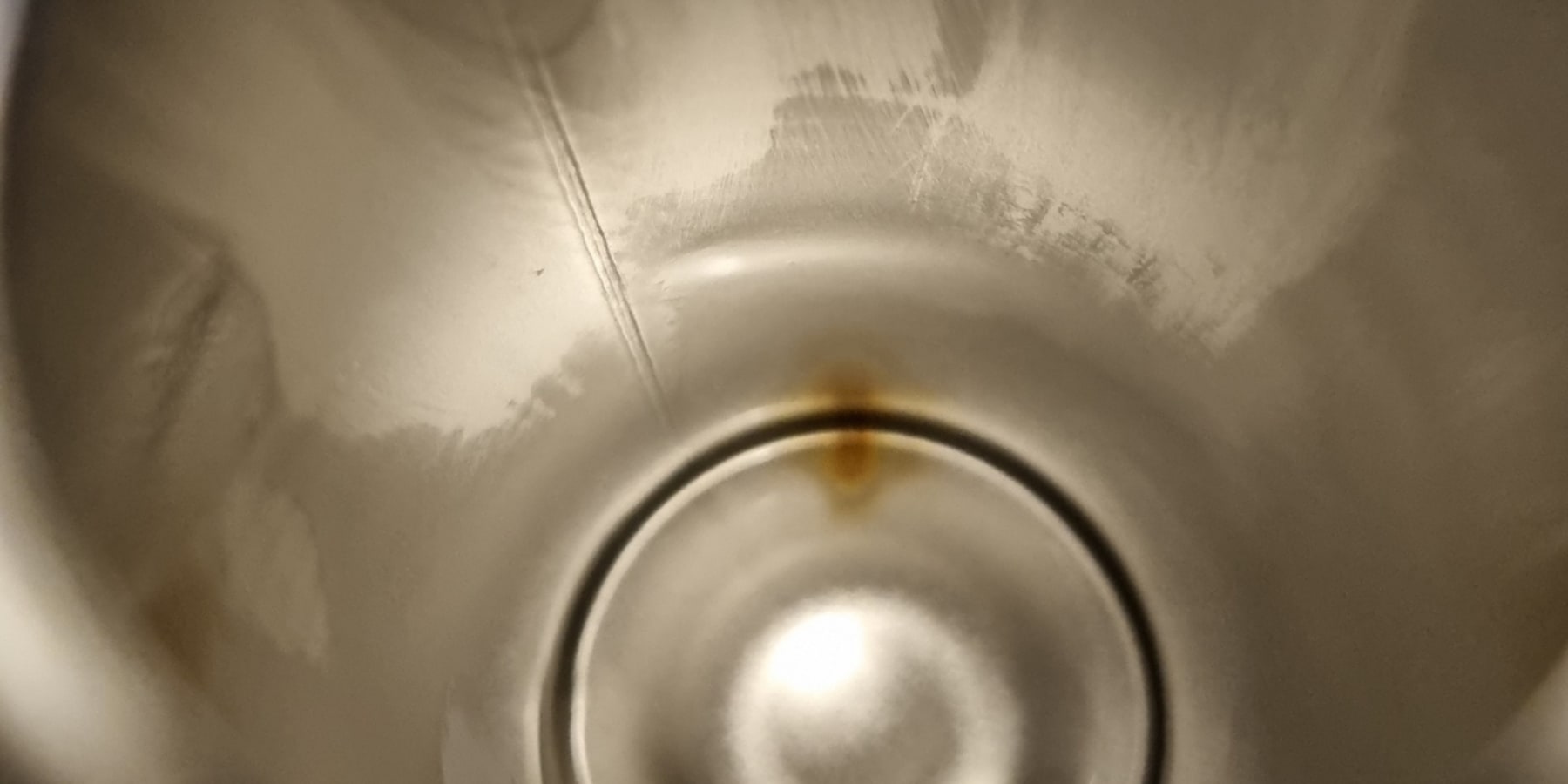 Inside of bottle with a rust mark