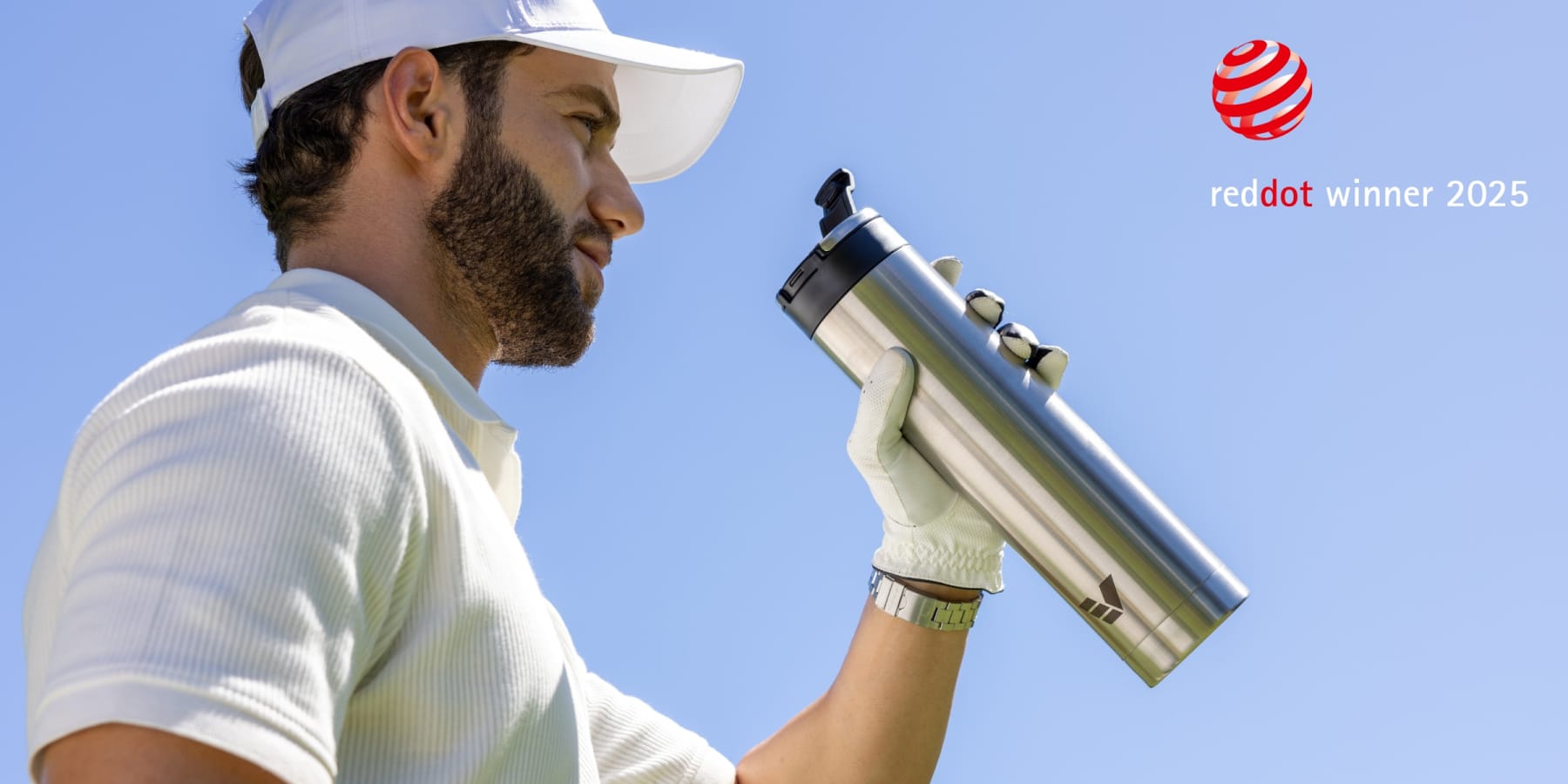 Ever Vessel Red Dot Design award blog image showing Super Maxi water bottle in golfer hand - plain stainless steel