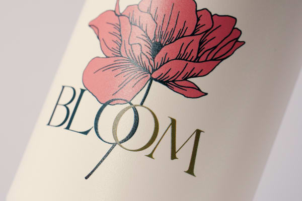 Custom water bottle of a flower company logo uv printed on a off white Ever Vessel