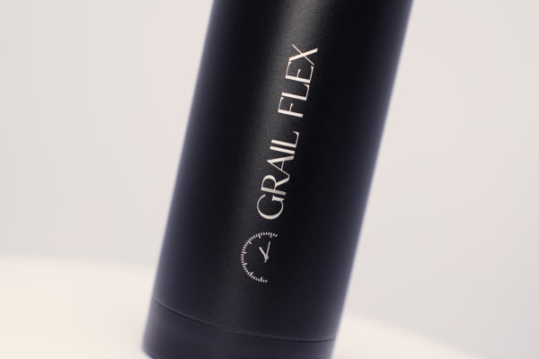 Custom water bottle of a watch company logo laser engraved on a black Ever Vessel